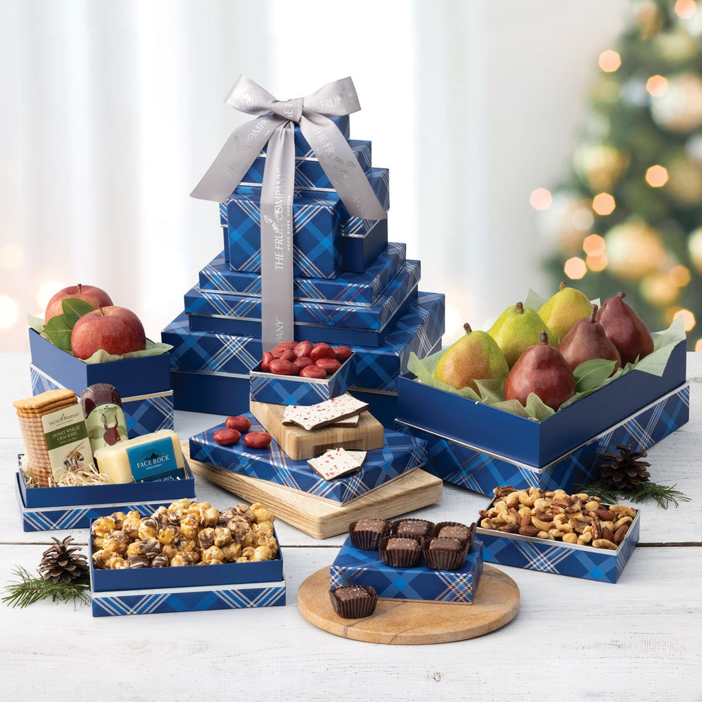 8 blue with silver trim and blue pear holiday themed boxes filled with fruit and treats and silver ribbon