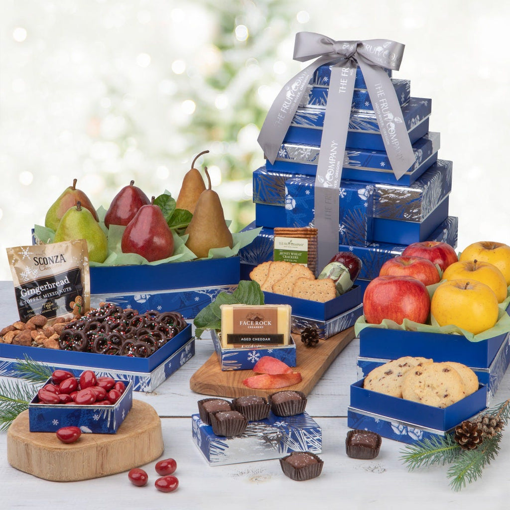 8 blue with silver trim and blue pear holiday themed boxes filled with fruit and treats and silver ribbon