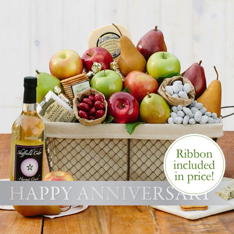 cloth & wire basket filled with fruit 3 artisan fresh cheeses 5 other treats Happy anniversary ribbon