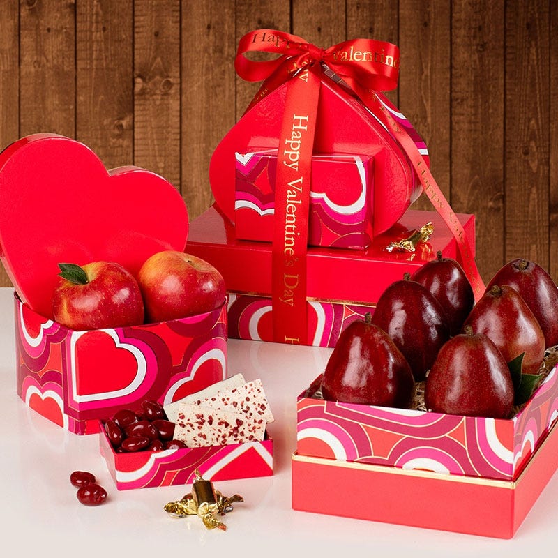 Different shade pink and red heart themed boxes and heart shaped box with 6 pears